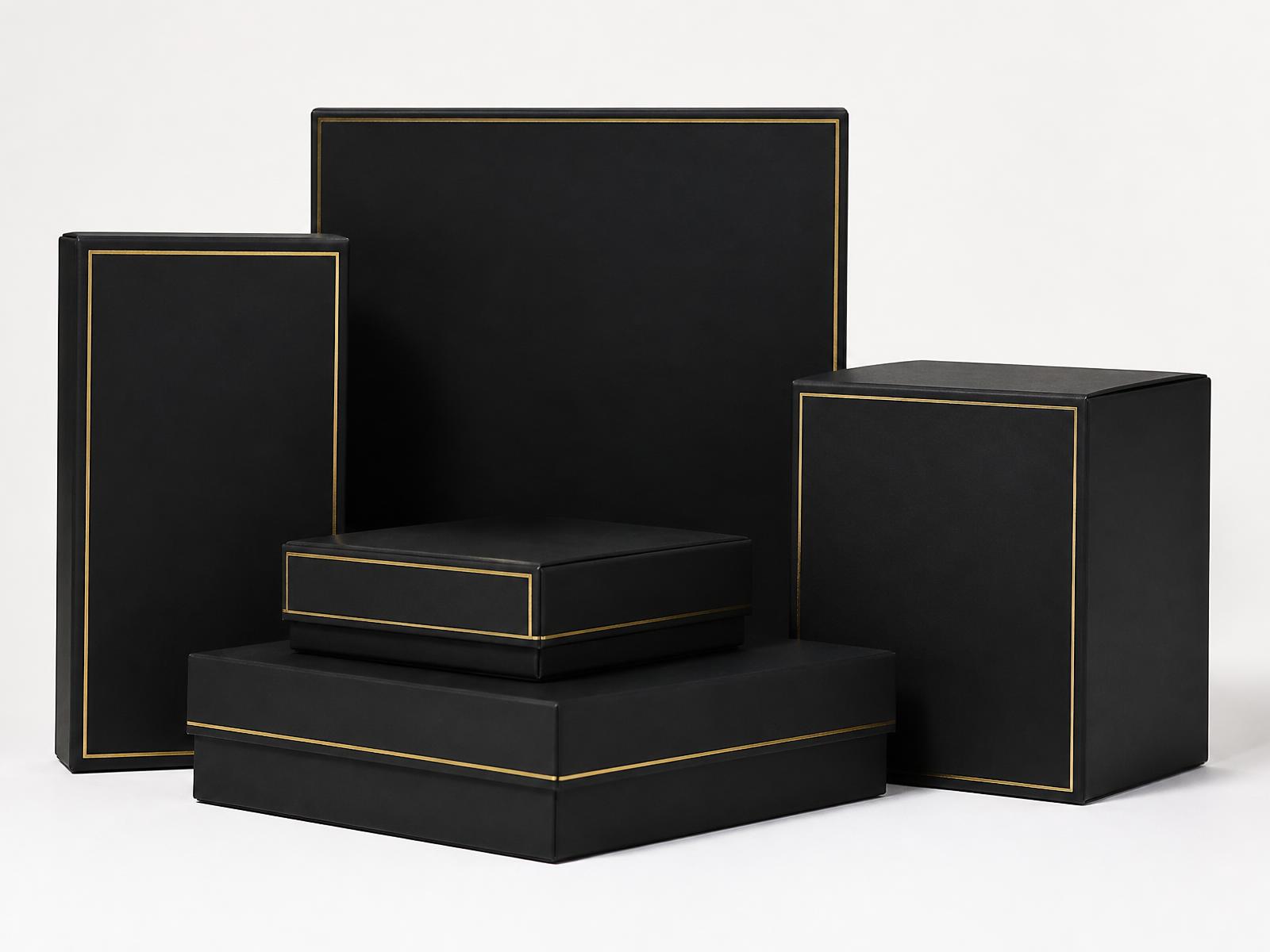 Matte black custom packaging boxes with gold foil branding